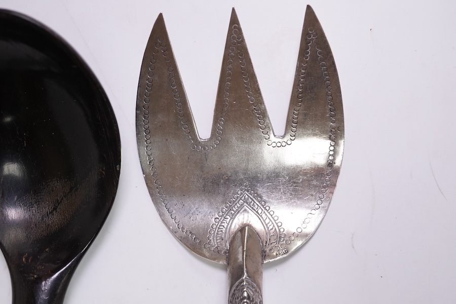 A pair of Malaysian/Indonesian white metal salad servers, fork 25.7cm and three other similar white metal handle horn servers. Condition - fair to good